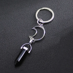 Silver sun and moon keychain with a black hexagonal crystal stone pendant for couples