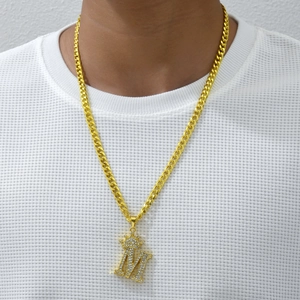 Hip-hop gold Cuban link necklace with crown M letter pendant on white waffle shirt