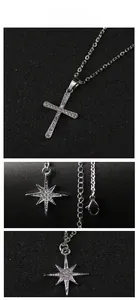 Detailed view of silver cross and star pendants with pave-set shimmering crystals