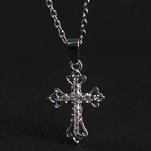 Cross pendant necklace with sparkling cubic zirconia on a minimalist silver chain