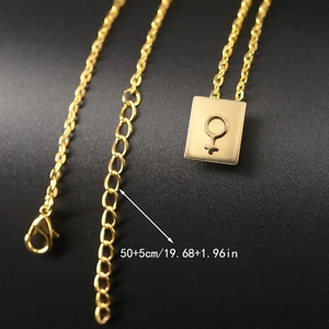 Detail of gold stainless steel necklace with size scale showing the adjustable clasp chain