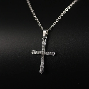 Minimalist silver cross pendant necklace with sparkling rhinestones on an O-chain link