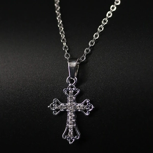 Vintage silver hollow cross necklace featuring sparkling crystals and polished O-chain link