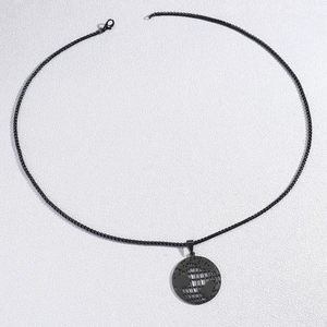 Minimalist matte black hollow earth globe pendant on a stainless steel box chain