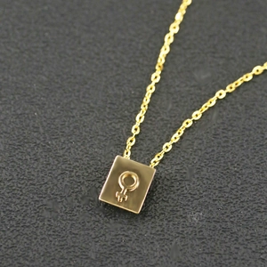 Gold stainless steel double layer necklace with female symbol pendant on black background