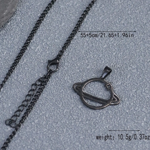 Macro shot of black Saturn planet pendant with dimensions 60cm chain length and 10.5g weight