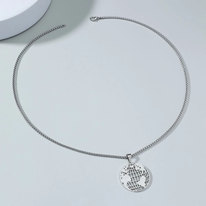 Detail of silver stainless steel hollow world map pendant on a polished box chain