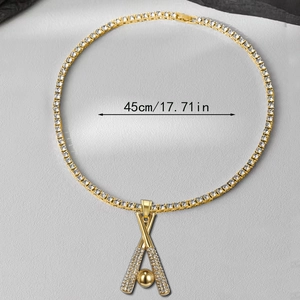 Close-up of gold iced-out baseball pendant and tennis chain with 45cm length detail
