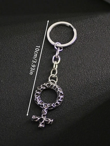 Macro detail of Viking female symbol keychain with hammered texture finish, 10cm length