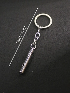 Close-up of a silver functional whistle keychain measuring 10cm or 3.39 inches in length