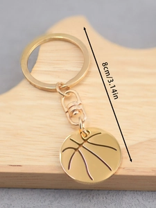 Detail view of 8cm golden basketball keychain pendant with realistic surface textures