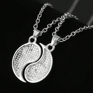 Matching Yin Yang necklaces for couples with polished silver-tone shimmering finish