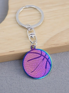Close-up of a gradient iridescent basketball metal keychain with a silver lobster clasp