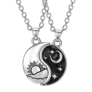 Matching sun and moon puzzle pendants with black enamel for couples on silver chains