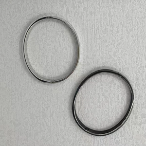 Sleek silver and black stainless steel bangles with Roman numerals and cross design