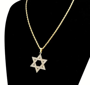 Close-up of hip hop gold rope chain with iced-out hexagram star pendant for men