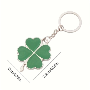 Green enamel four-leaf clover keychain with silver metal accents and size dimensions
