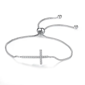 Adjustable silver cross bracelet with cubic zirconia paving on a polished box chain
