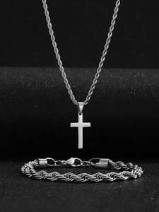 Detail of silver twisted rope chain necklace with cross pendant and matching bracelet set