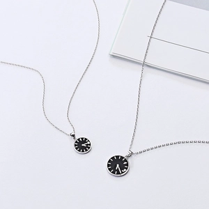 Minimalist alloy clock pendant necklace set with stainless steel chain on white surface