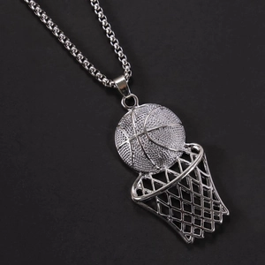 Close-up of silver basketball and hoop pendant with detailed mesh and square pearl chain