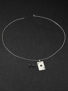 Detailed view of titanium steel jewelry set featuring ace of spades poker card design