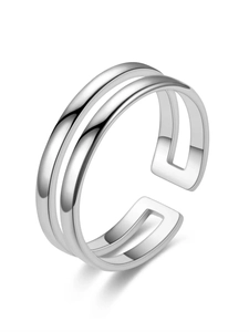 Detail of adjustable silver double-layer open ring with polished metal finish