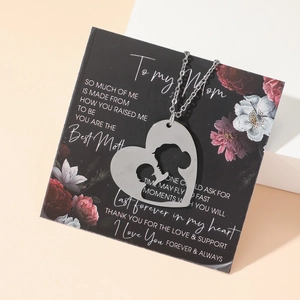 Edelstahl Herzanhänger mit Mutter-Kind-Silhouette auf Geschenkkarte mit Blumendesign