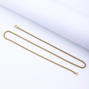 Detailed macro shot of 2.5mm gold stainless steel box chain with secure lobster clasp