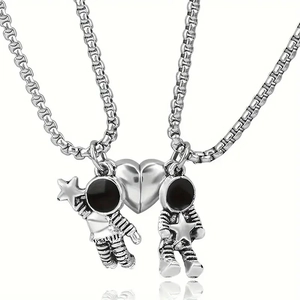 Magnetic astronaut couple necklace with split heart pendant on silver chains