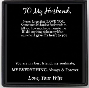 Detailed view of matte black gift card with sentimental message for husband to soulmate
