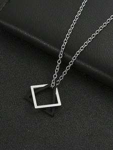 Close-up of geometric square pendant necklace in silver and matte black steel