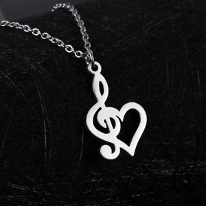 Polished stainless steel treble clef heart pendant necklace on minimalist link chain