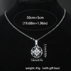 Silver flower pendant necklace with clear zircon stones on a black neck display