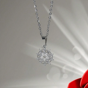 Detail of snowflake sunflower pendant with white pearls and sparkling rhinestones