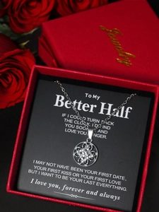 Sparkling silver flower pendant necklace in a red gift box with a romantic message card