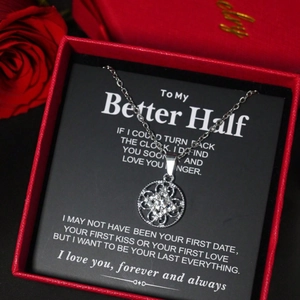 Elegant silver flower pendant necklace with diamonds in a red gift box and card