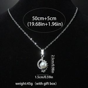 Detailed view of pearl pendant showing dimensions of 2.5cm by 1.5cm on a silver chain