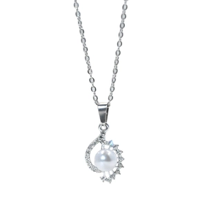 Elegant silver conch pearl necklace with radiant diamond accents on a minimalist chain