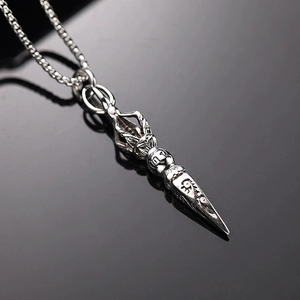 Vintage silver Vajra pestle necklace pendant with intricate religious ethnic patterns