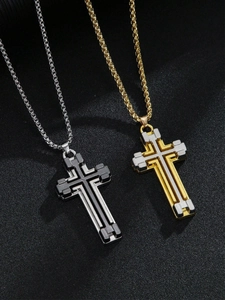 Close-up of industrial multi-layer cross pendants in silver, gold, and black finishes