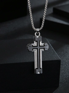 Detail of silver and black dual-tone layered cross pendant for men with box chain