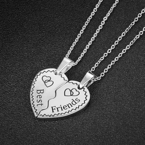 Silver interlocking heart pendants on fine chains engraved with Best Friends on leather