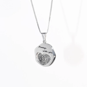 Polished stainless steel pendant necklace with heart cutout and Always with you engraving