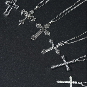 Set of gothic and classic stainless steel cross necklaces for men on black background