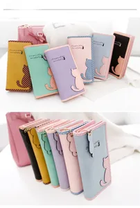 Close-up of pastel women wallets featuring cute cat applique and polka dot patterns
