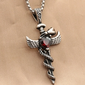 Vintage sword cross necklace with red heart stone, snake detail, and wings design