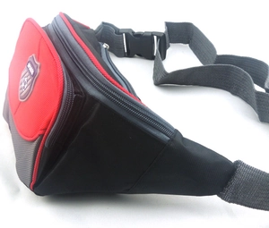 Detail of multi-pocket sports waist bag with zipper compartments and nylon fabric