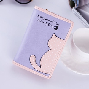 Detail view of purple women's wallet with cute cat embroidery and gold zipper closure