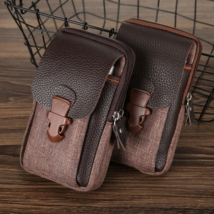 Close-up of brown PU leather and canvas men's phone waist bag with double zipper pockets